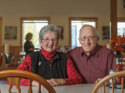 photo of elderly man and woman sitting at a Dysart's table