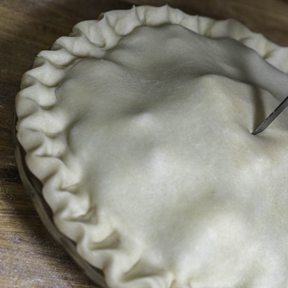 photo of a strawberry rhubarb pie pre baked